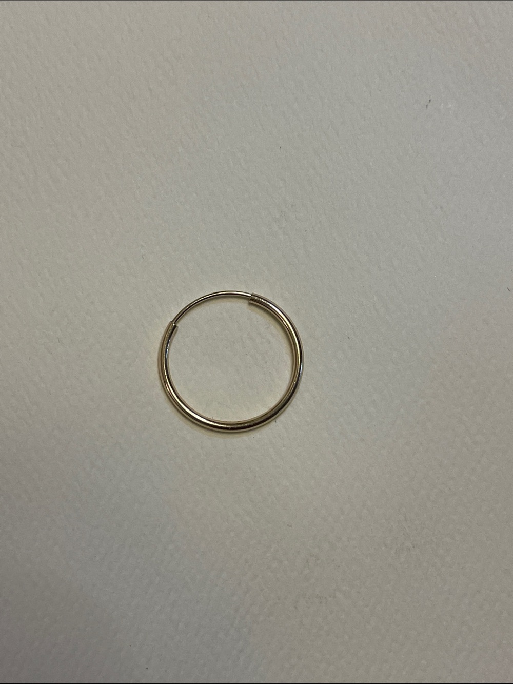 Single 14k gold hoop earring